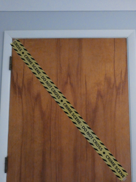 door with caution tape